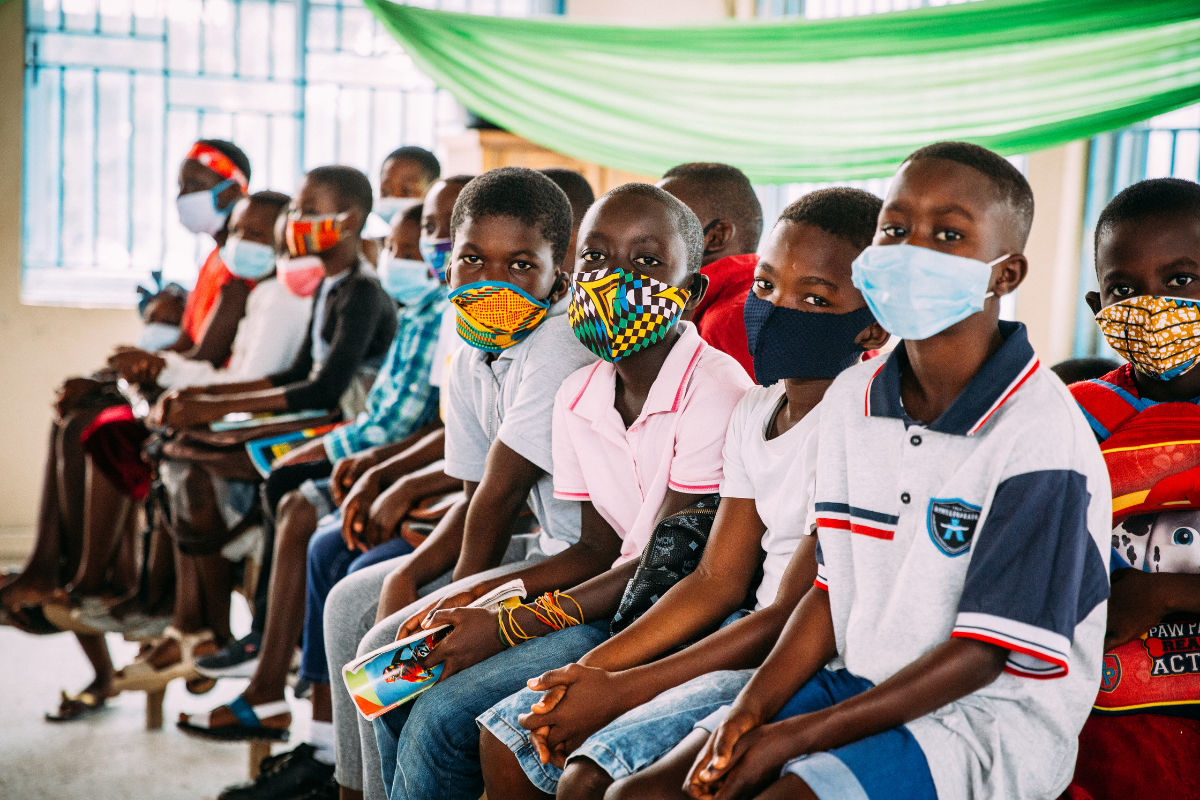 Youth in Ghana pose in masks as we mark the one year anniversary of COVID-19
