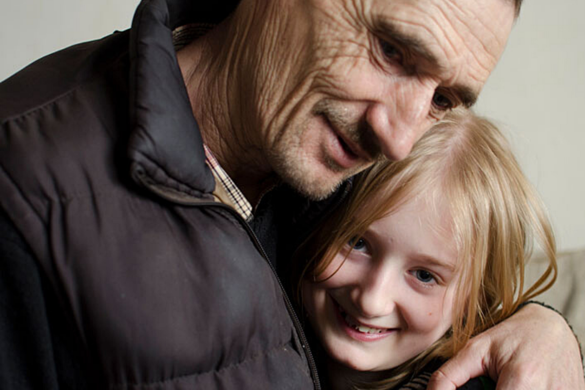 Picture of child hugging father