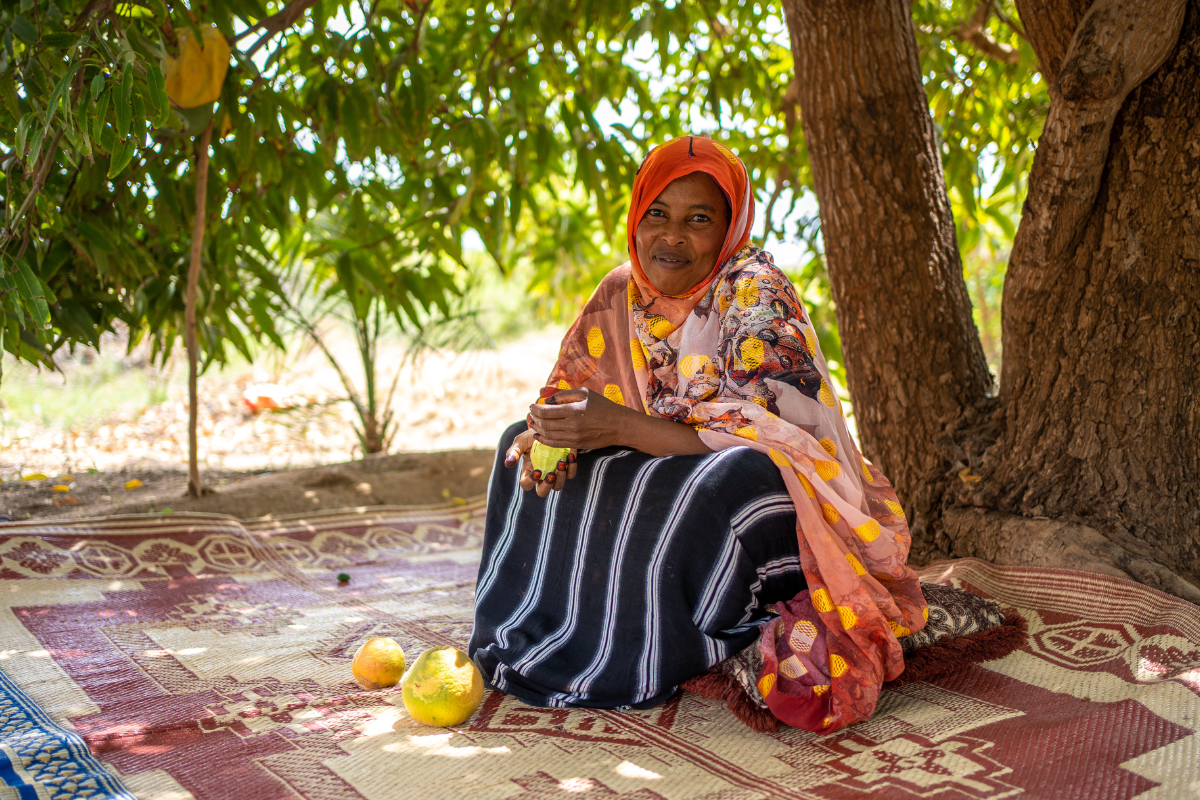 Farhiya from Somaliland walks around her farm checking at what is left of her failing crops. 