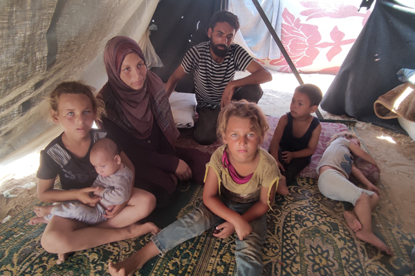 A family living in a tent in Gaza.