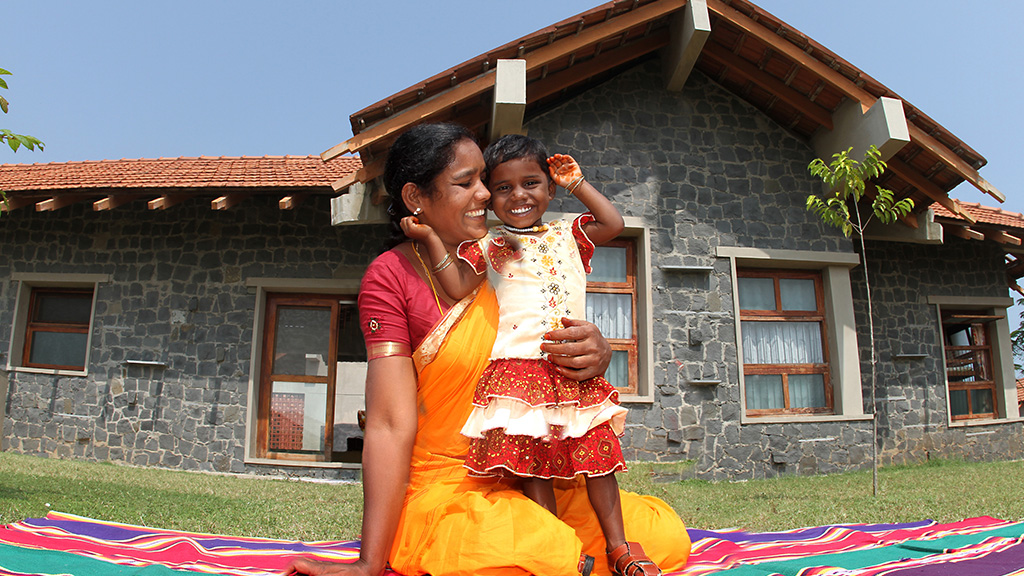 Happy mother and child smiling at each other