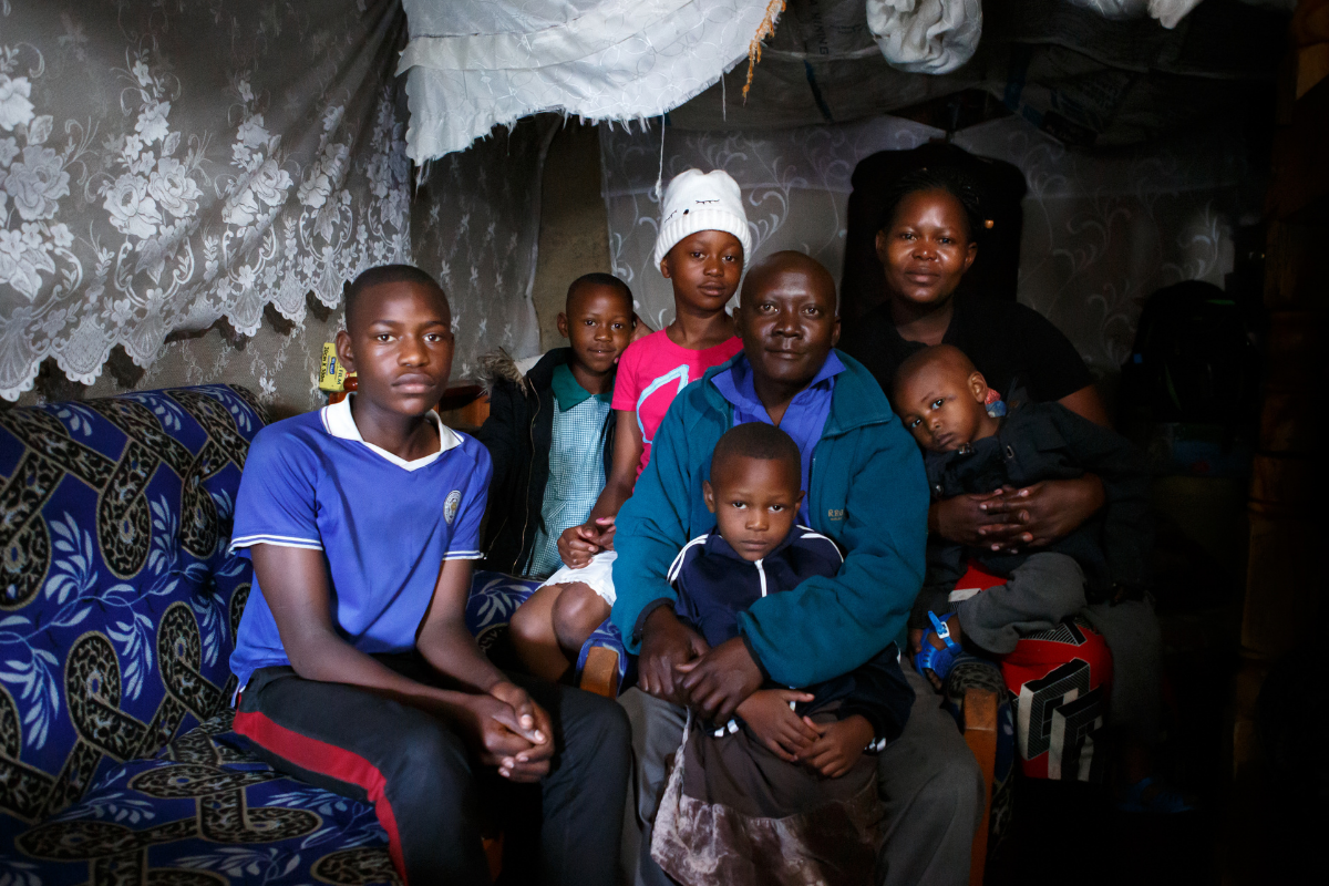 Daniel from Kenya poses with his family