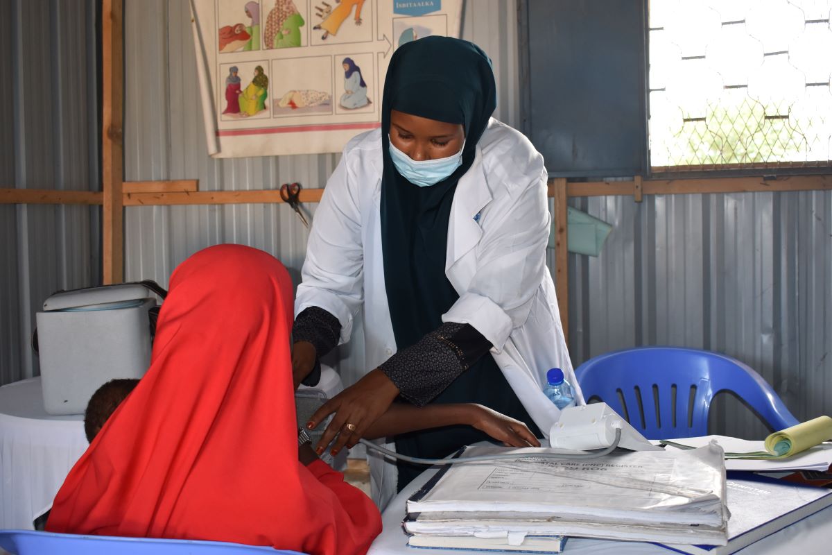 Halima Ahmed Dalel works on a patient