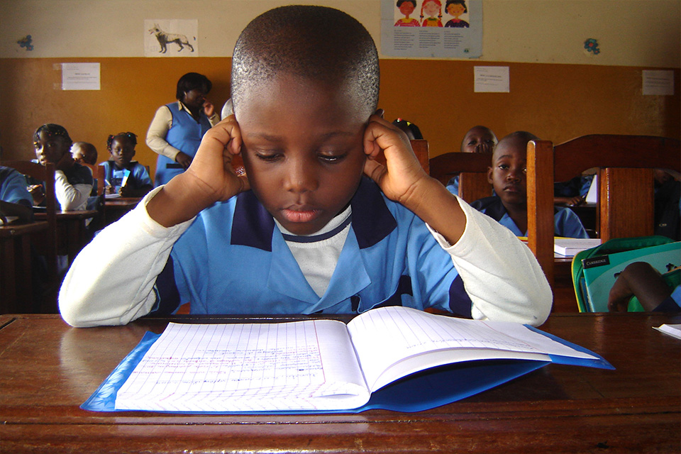 A child looking at his text book
